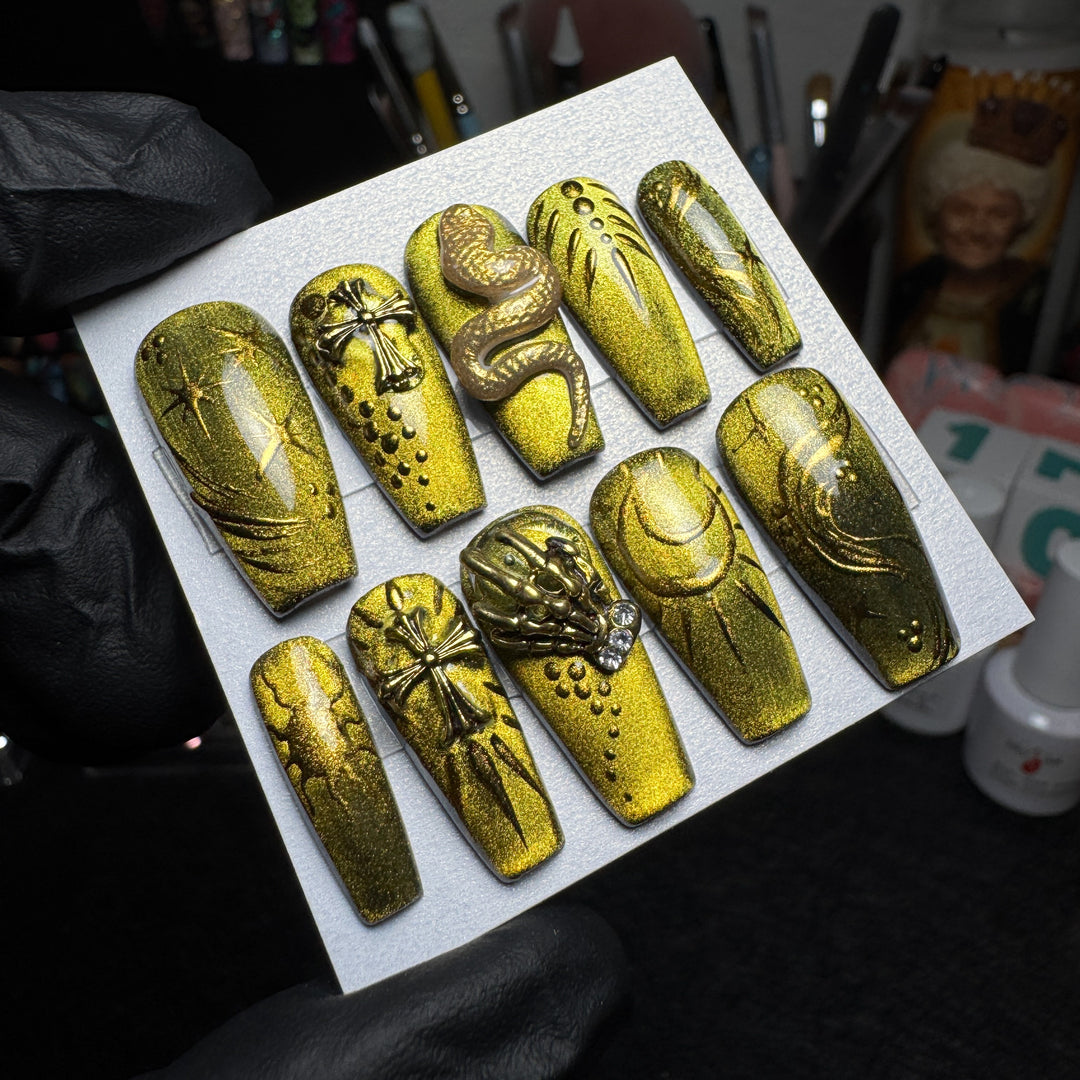 Gothic press-on nails with gilded snakes and antique relic details