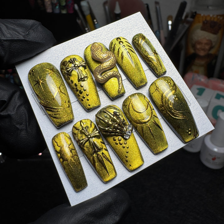 Gothic press-on nails with gilded snakes and antique relic details